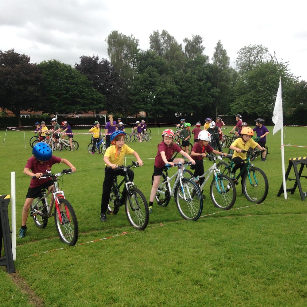 Children on their bikes at the start line during a Pro Ride cycling day